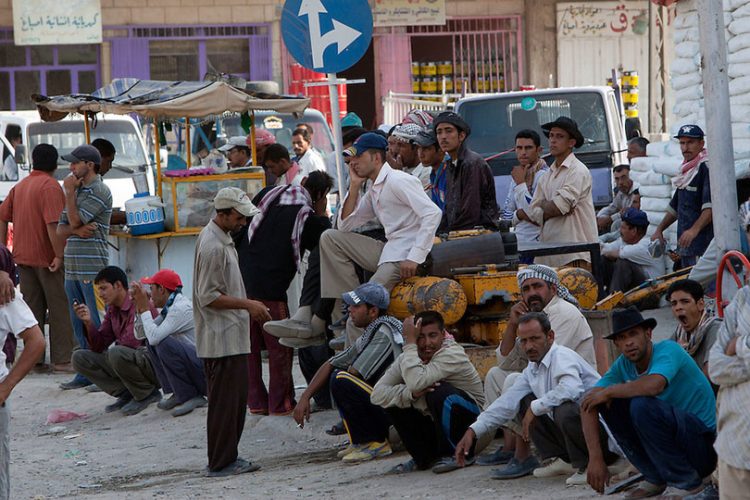 Unemployed Iraqi men wait on a southwest Baghdad street for possible work as day laborers August 25, 2010. The unemployment rate in Iraq is pegged officially at around 20%, although the real number is considered to be much higher.