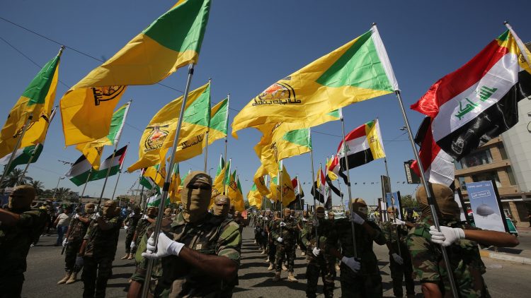 Iraqi Shiite fighters from the Iran-backed armed group, Hezbollah brigades, march during a military parade marking Al-Quds (Jerusalem) International Day in Baghdad, on May 31, 2019. - An initiative started by the late Iranian revolutionary leader Ayatollah Ruhollah Khomeini, Quds Day is held annually on the last Friday of the Muslim fasting month of Ramadan and calls for Jerusalem to be returned to the Palestinians . (Photo by AHMAD AL-RUBAYE / AFP)        (Photo credit should read AHMAD AL-RUBAYE/AFP via Getty Images)