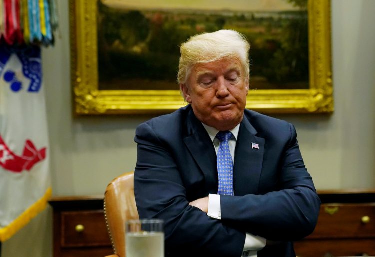 U.S. President Donald Trump reacts while holding a roundtable on the Foreign Investment Risk Review Modernization Act at the White House in Washington, U.S., August 23, 2018.  REUTERS/Kevin Lamarque