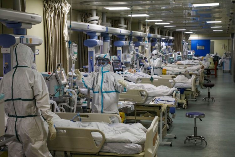 Medical workers in protective suits attend to novel coronavirus patients at the intensive care unit (ICU) of a designated hospital in Wuhan, Hubei province, China February 6, 2020. Picture taken February 6, 2020. China Daily via REUTERS  ATTENTION EDITORS - THIS IMAGE WAS PROVIDED BY A THIRD PARTY. CHINA OUT. - RC2UWE9N0S1O